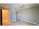 Bedroom with tiled floor, ceiling fan, and mirrored closet at 5317 Micco St, Kissimmee, FL 34746