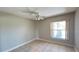 Comfortable bedroom featuring tiled floor and bright window at 5317 Micco St, Kissimmee, FL 34746