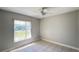 Sunlit bedroom with tiled floors and a ceiling fan at 5317 Micco St, Kissimmee, FL 34746