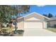 Charming single-Gathering home featuring a two-car garage, well-maintained lawn, and mature trees at 5317 Micco St, Kissimmee, FL 34746