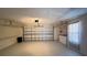 Clean, spacious two-car garage equipped with laundry appliances and ample storage space at 5317 Micco St, Kissimmee, FL 34746