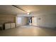 Well-lit garage featuring laundry appliances, an attached furnace, and a doorway to the main house at 5317 Micco St, Kissimmee, FL 34746