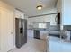 Well-lit kitchen featuring stainless steel appliances and crisp white cabinetry at 5317 Micco St, Kissimmee, FL 34746