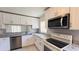 Modern kitchen with stainless steel appliances, granite countertops, and ample natural light at 5317 Micco St, Kissimmee, FL 34746