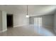 Spacious living room with tile flooring and ample natural light from the sliding door at 5317 Micco St, Kissimmee, FL 34746