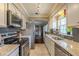 Bright kitchen with modern appliances and granite countertops at 720 Shore Drive, Kissimmee, FL 34744