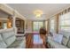 Spacious living room with hardwood floors, natural light, and neutral paint at 720 Shore Drive, Kissimmee, FL 34744