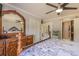 Comfortable main bedroom with dresser and mirrors, white closet doors, and patterned bedding at 720 Shore Drive, Kissimmee, FL 34744