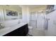 Modern bathroom with double vanity and glass shower enclosure at 1401 Hollow Creek Ln, Kissimmee, FL 34744