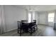 Dining room with modern table and chairs, and wood-look flooring at 1401 Hollow Creek Ln, Kissimmee, FL 34744