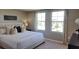 Large main bedroom with plush bedding and plenty of natural light at 1401 Hollow Creek Ln, Kissimmee, FL 34744