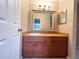 Traditional bathroom vanity with mirror, sink and ample storage at 3180 Owassa Ct, Kissimmee, FL 34746