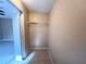 Walk in closet features tile flooring and a wire shelf at 3180 Owassa Ct, Kissimmee, FL 34746