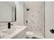 Updated bathroom with marble shower and modern vanity at 4401 Marshall St, Orlando, FL 32811