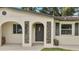 Renovated entryway with arched details and a modern door at 4401 Marshall St, Orlando, FL 32811