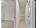 Clean hallway with wood-look flooring leading to bedrooms and bathrooms at 4401 Marshall St, Orlando, FL 32811