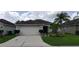 Attractive home with a lush front lawn and mature palm trees providing curb appeal at 7139 Cedarcrest Blvd, Lakeland, FL 33810