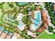 An aerial view reveals the resort-style amenities, including multiple pools, lazy river, and lush landscaping at 6012 Oak Green Loop, Davenport, FL 33837