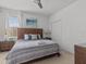 Bedroom with a wooden headboard and matching side tables at 6012 Oak Green Loop, Davenport, FL 33837