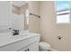 Bathroom features a white vanity, toilet, and shower/tub combo at 914 Heirloom Dr, Haines City, FL 33844