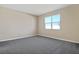 Bright bedroom with neutral walls and grey carpet at 914 Heirloom Dr, Haines City, FL 33844