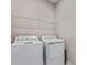 Laundry room with washer, dryer and shelving at 914 Heirloom Dr, Haines City, FL 33844