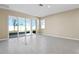 Living area with tile floors and sliding glass doors leading to the patio at 914 Heirloom Dr, Haines City, FL 33844