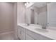 Modern bathroom with double vanity and a large mirror at 918 Heirloom Dr, Haines City, FL 33844