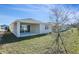 Back exterior of house with covered patio at 918 Heirloom Dr, Haines City, FL 33844