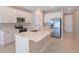 Modern kitchen with white cabinets and stainless steel appliances at 918 Heirloom Dr, Haines City, FL 33844