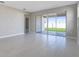 Bright living room with sliding glass doors to backyard at 918 Heirloom Dr, Haines City, FL 33844