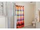 Bathroom with shower and colorful shower curtain at 2419 Willow Tree Ln, Kissimmee, FL 34758