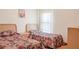 Guest bedroom with two twin-size beds at 2419 Willow Tree Ln, Kissimmee, FL 34758