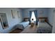 Two twin beds in a bright bedroom with light blue walls and decorative wall art at 730 Brunello Dr, Davenport, FL 33897