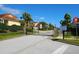 Gated community entrance with well-maintained landscaping at 730 Brunello Dr, Davenport, FL 33897