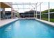 Screened pool area with patio furniture at 730 Brunello Dr, Davenport, FL 33897