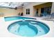 Relaxing pool and spa with patio furniture at 730 Brunello Dr, Davenport, FL 33897