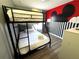 Bedroom with bunk beds and Mickey Mouse decor at 3189 Yellow Lantana Ln, Kissimmee, FL 34747