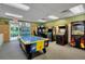 Fun game room featuring air hockey and arcade games at 3189 Yellow Lantana Ln, Kissimmee, FL 34747