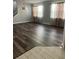 Spacious dining room featuring hardwood floors and large windows at 11460 Chateaubriand Ave, Orlando, FL 32836