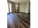 Sunlit dining room with hardwood floors and access to backyard at 11460 Chateaubriand Ave, Orlando, FL 32836