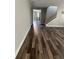 Bright entryway with luxury vinyl plank flooring and view of staircase at 11460 Chateaubriand Ave, Orlando, FL 32836