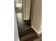 Hardwood floor hallway with access to bedrooms at 11460 Chateaubriand Ave, Orlando, FL 32836