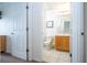 Clean bathroom with wood vanity and toilet at 8545 Bay Lilly Loop, Kissimmee, FL 34747
