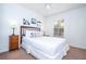 Cozy bedroom with a queen bed and wooden nightstands at 8545 Bay Lilly Loop, Kissimmee, FL 34747