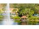 Lakefront gazebo with fountain and tropical landscaping at 8545 Bay Lilly Loop, Kissimmee, FL 34747