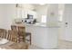 Kitchen with granite countertops, white cabinets, and breakfast bar at 8545 Bay Lilly Loop, Kissimmee, FL 34747