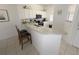 Kitchen boasts granite countertops and breakfast bar with seating at 8545 Bay Lilly Loop, Kissimmee, FL 34747