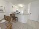 Open kitchen with granite countertops and breakfast bar at 8545 Bay Lilly Loop, Kissimmee, FL 34747