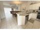 Bright kitchen with granite countertops, stainless steel appliances, and white cabinets at 8545 Bay Lilly Loop, Kissimmee, FL 34747